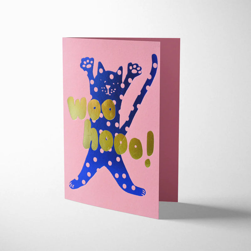 Greeting card with a blue cat illustration and 'woohoo!' text on a pink background