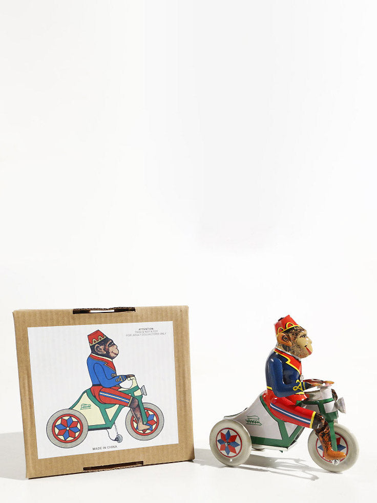 Monkey on a tricycle (13 cm)