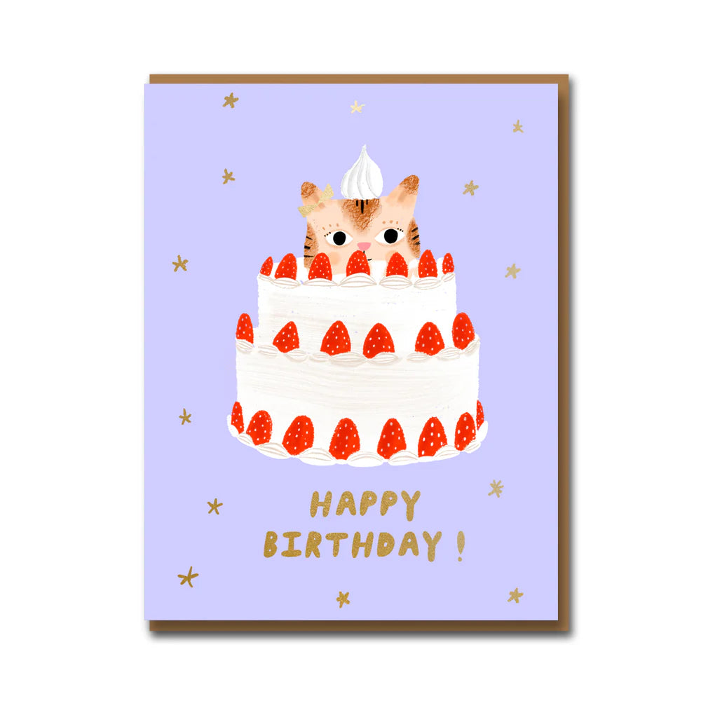 Birthday card with a cat peeking out from a cake on a purple background