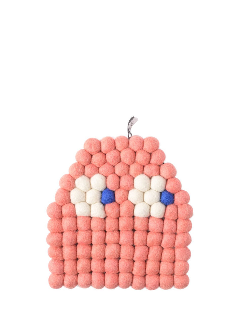 A pink felted wool monster trivet