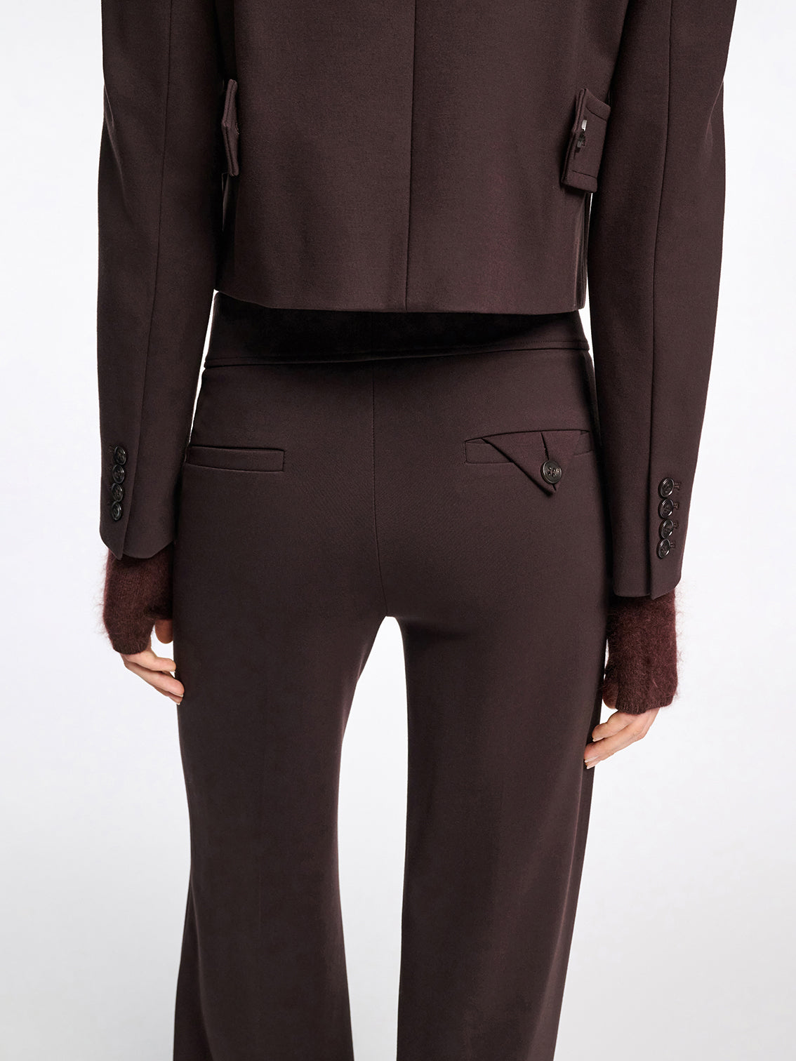 Brown suit jacket and pants on a white background