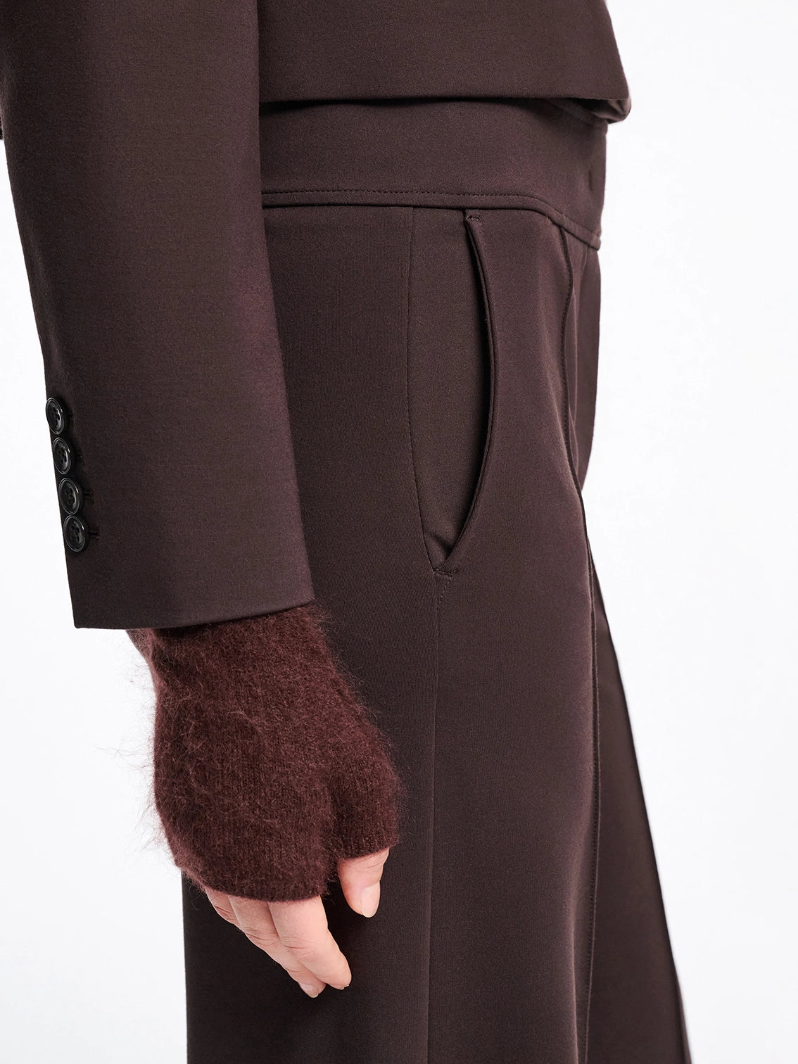 Brown coat with matching fingerless gloves on a white background