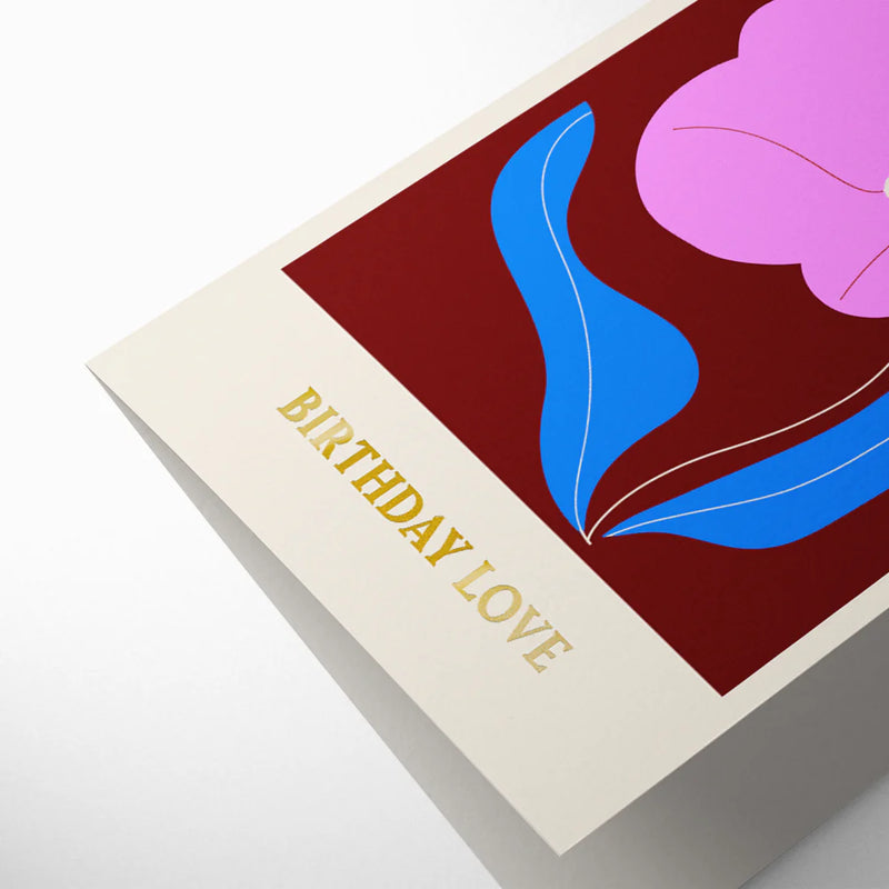 Greeting card with 'Birthday Love' text and colorful floral design on a white background