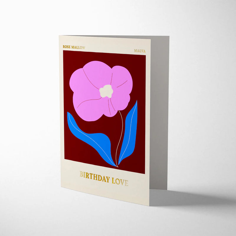 Greeting card with a pink flower design on a red background