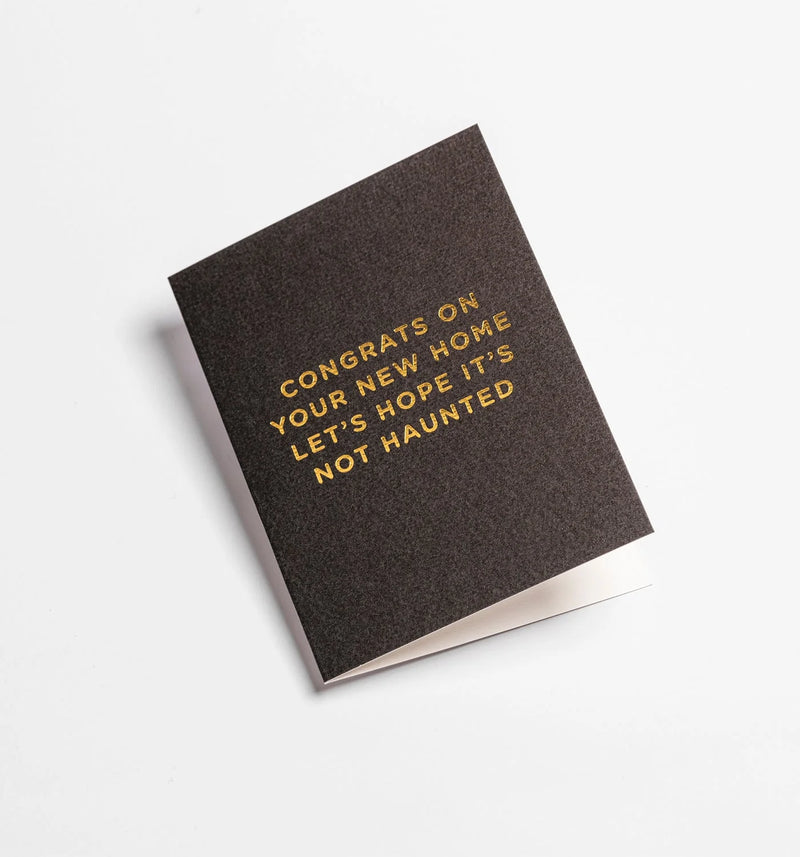 Greeting card with gold text on a dark background