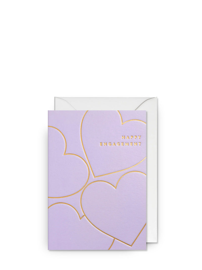 Purple card with gold heart design and 'Happy Engagement' text on a white background