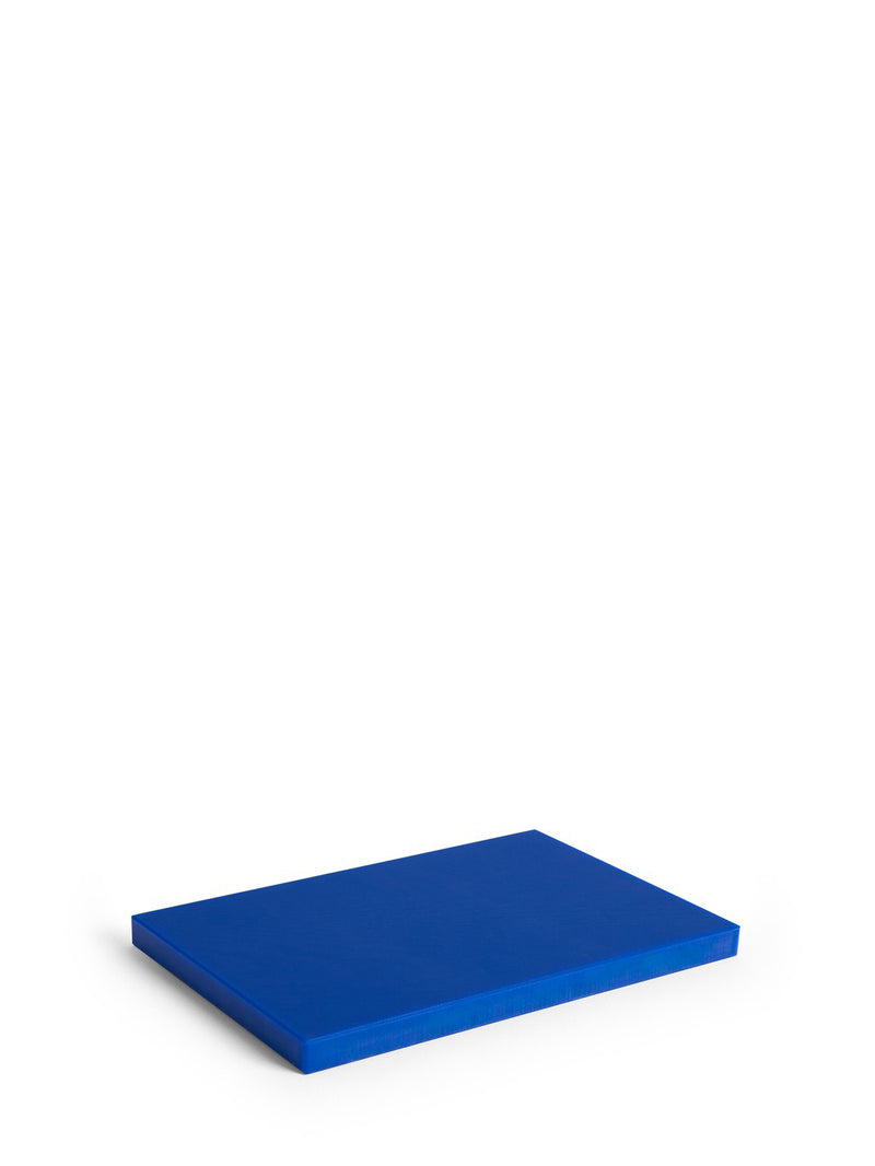A solid blue rectangular chopping board shown from an elevated perspective on a clean white background.