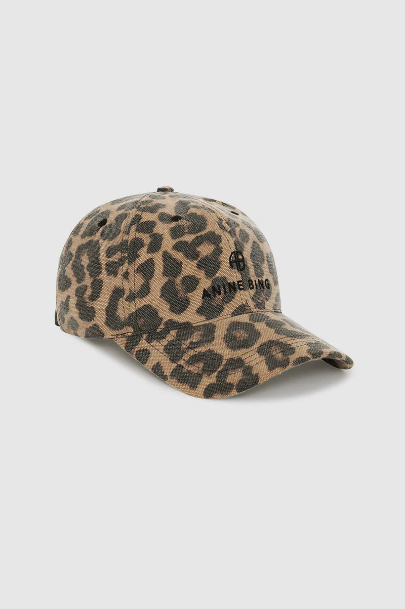 Leopard print cap with branding on a light gray background