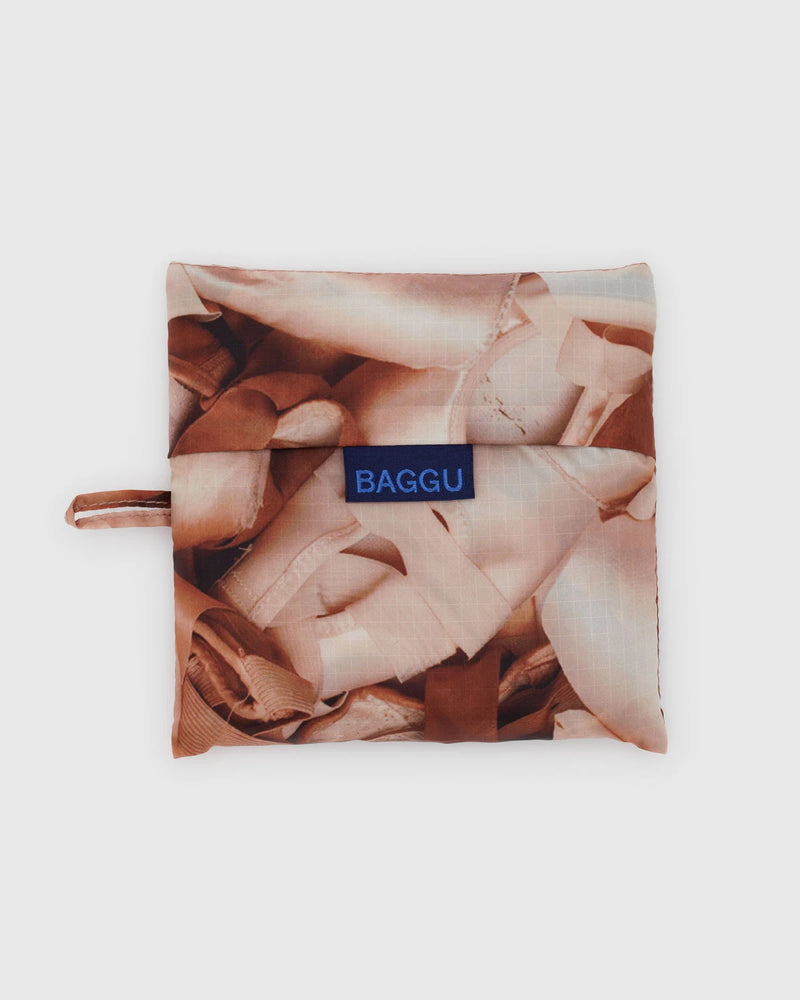 Reusable shopping bag with 'BAGGU' logo on a white background