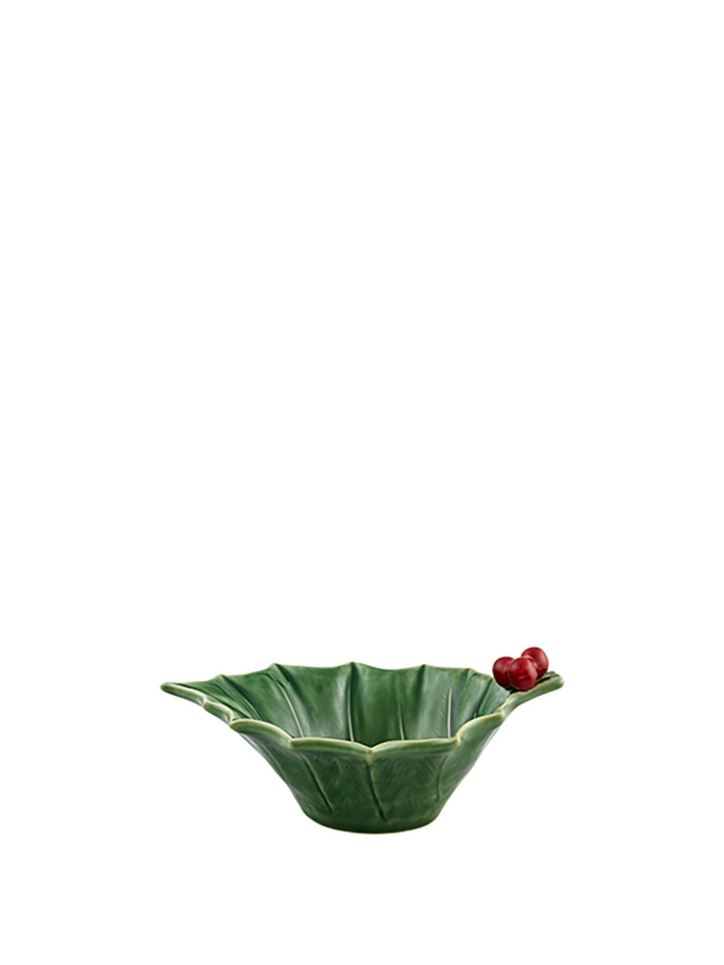 Green ceramic bowl with a leaf-like design on a white background