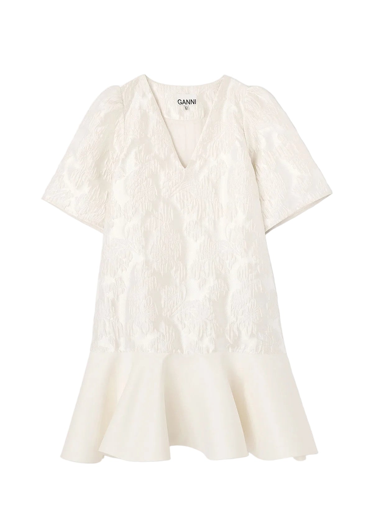 White textured dress on a light gray background with 'Ganni' branding.