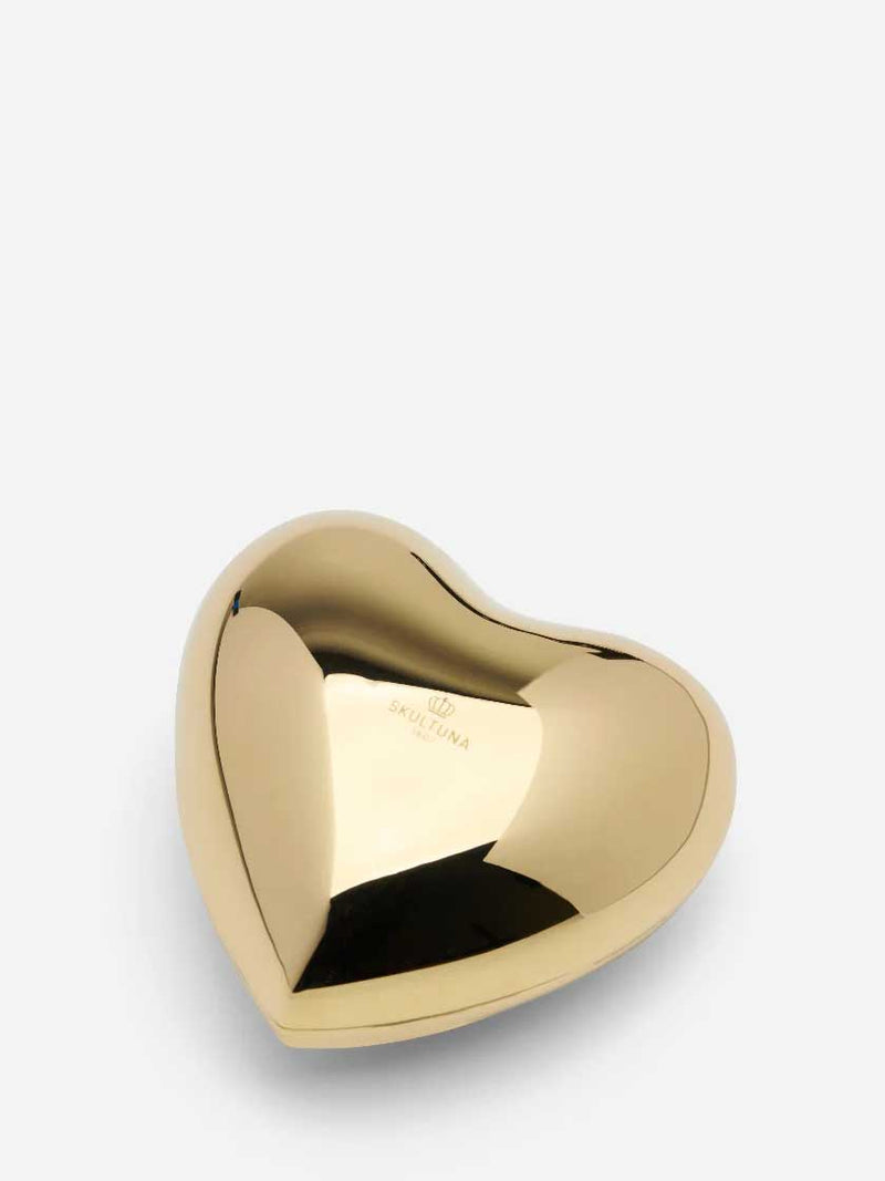 Gold heart-shaped brass jewellery box on a white background