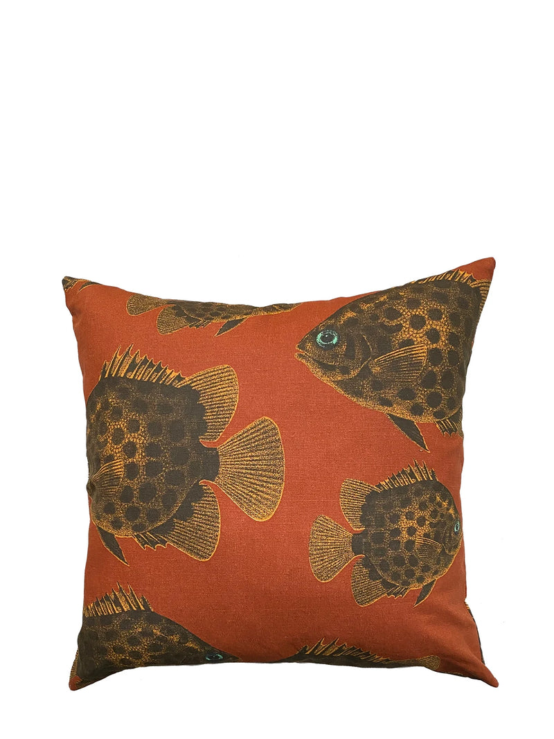 Decorative pillow with fish pattern on a white background