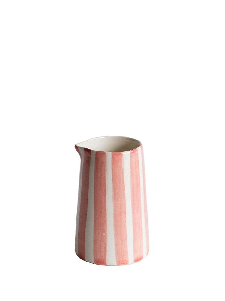 Ceramic pitcher with rose and white stripes on a light gray background