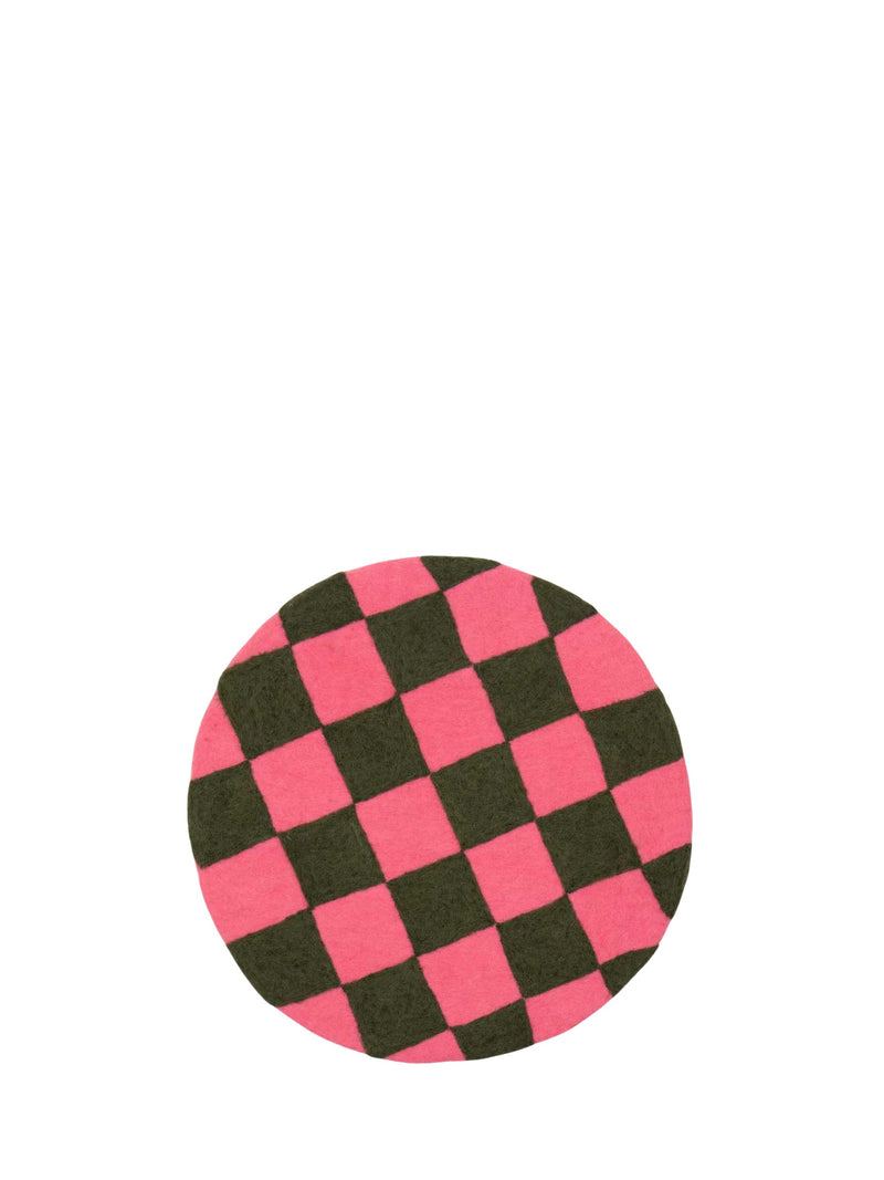 Round pink and black checkered object on a white background