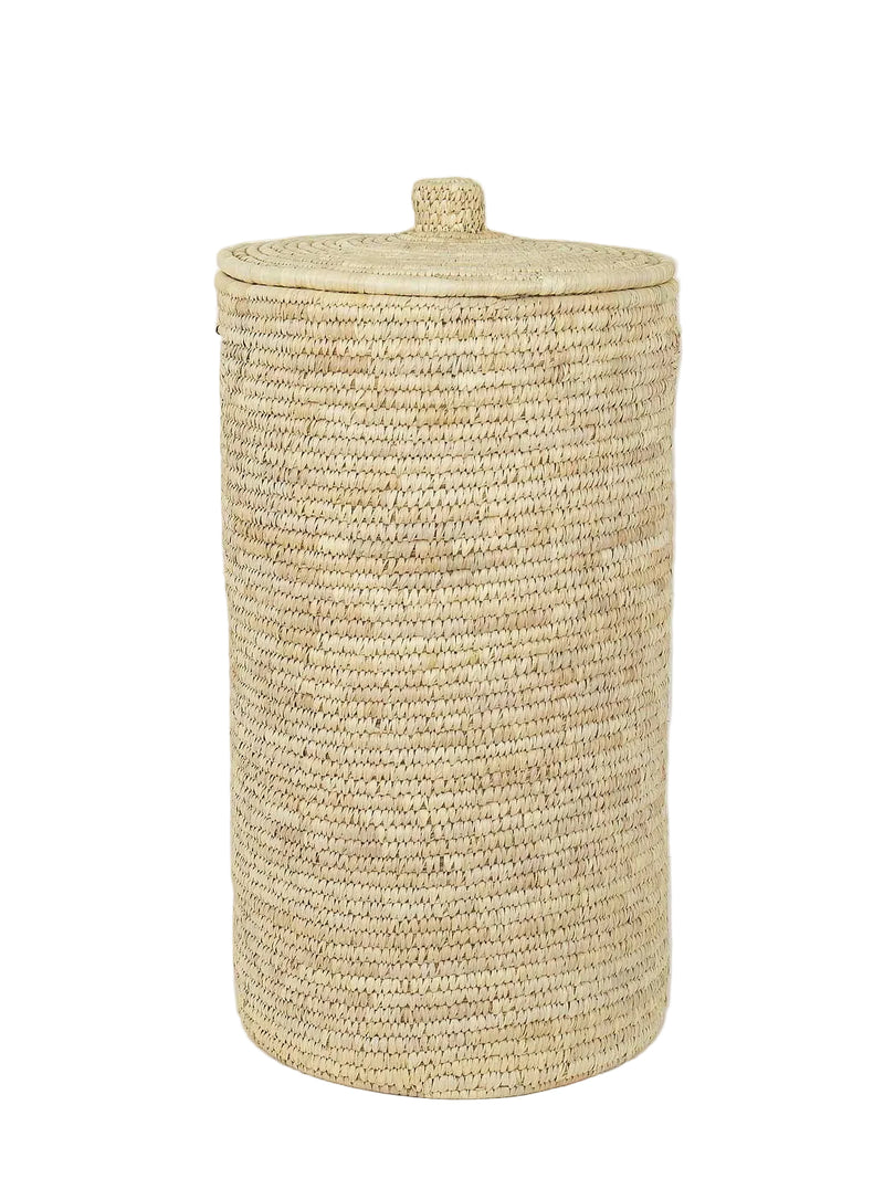 Woven palm straw laundry basket with a lid on a white background.
