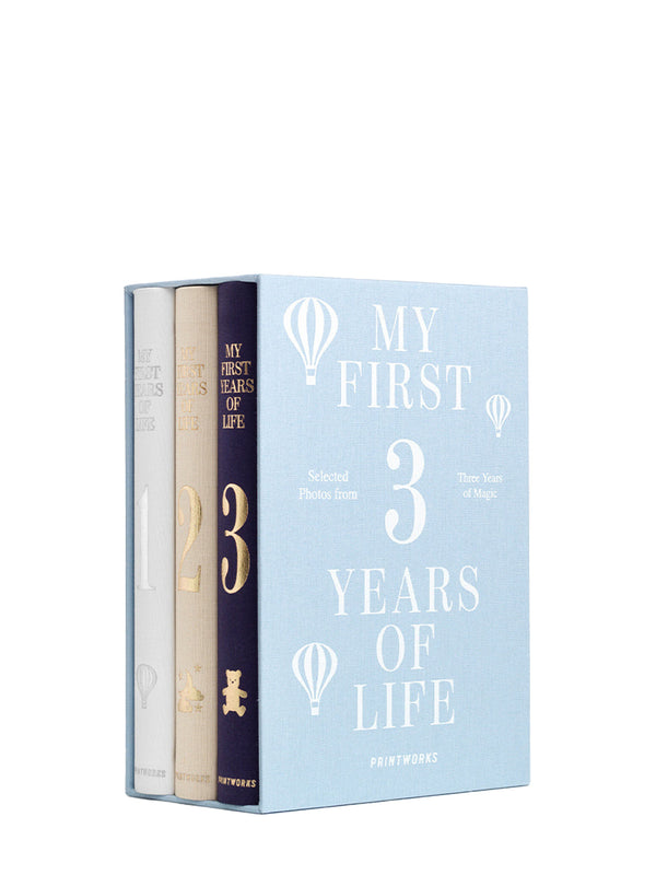 Book titled 'My First 3 Years of Life' with a white cover and gold text on a white background