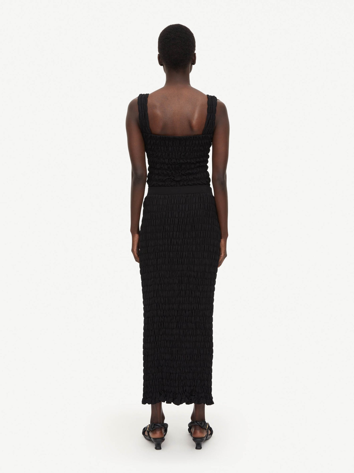 Malene Birger: EMLA shirred maxi skirt, black. Sold by My o My Helsinki.