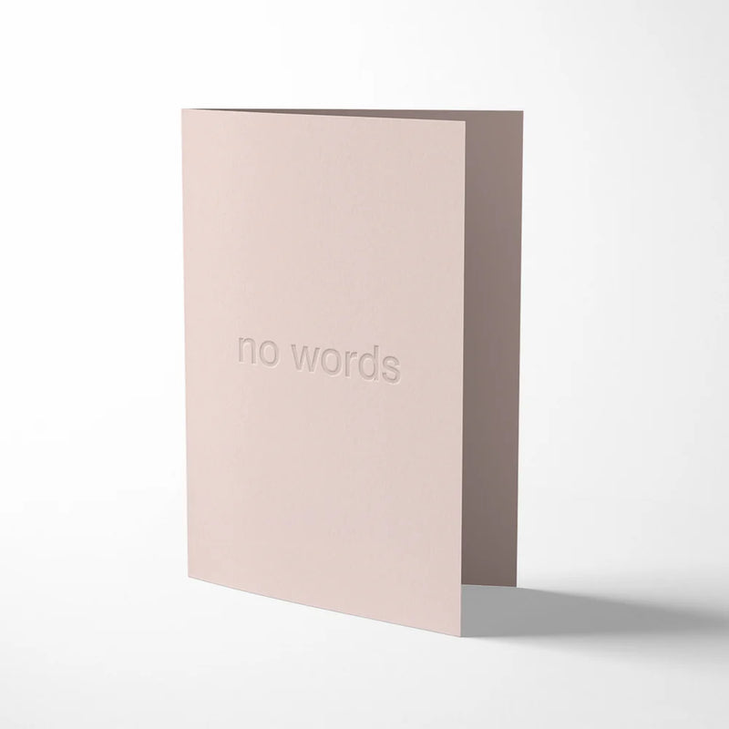 Pink greeting card with 'no words' text on a white background