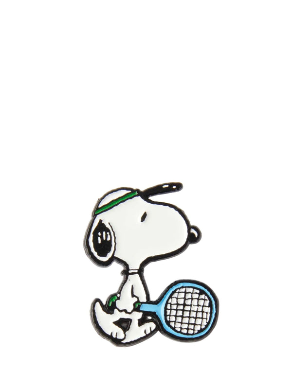 Snoopy pin holding a tennis racket on a white background