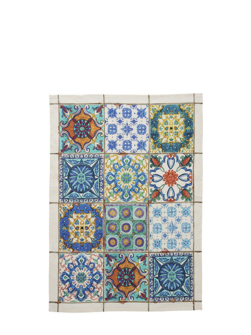 Colorful patchwork of decorative tiles on a white background