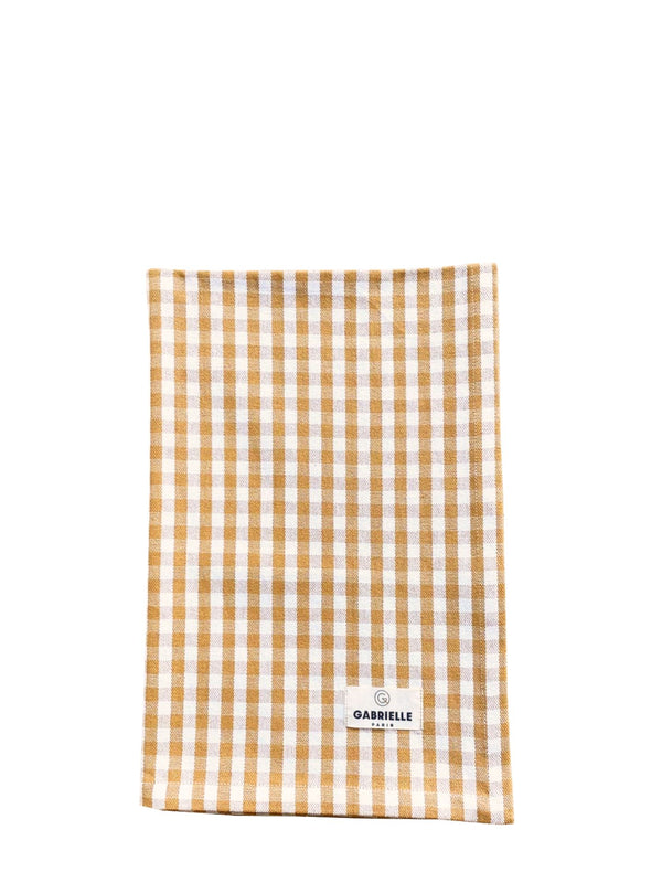 Checkered towel with a brand label on a white background