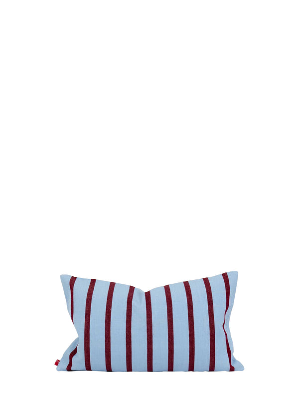 Striped pillow with red and blue pattern on a white background