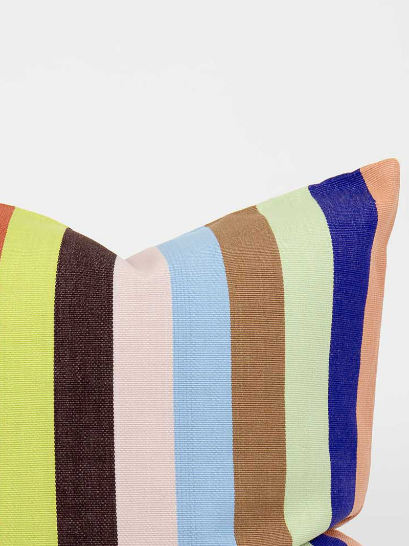 Colorful striped pillow with a neutral background