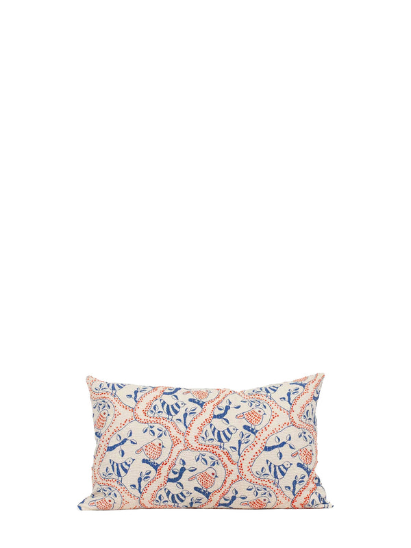 A rectangular cushion emroidered with blue birds and leaves and red decorative pattern and photographed against white backround.