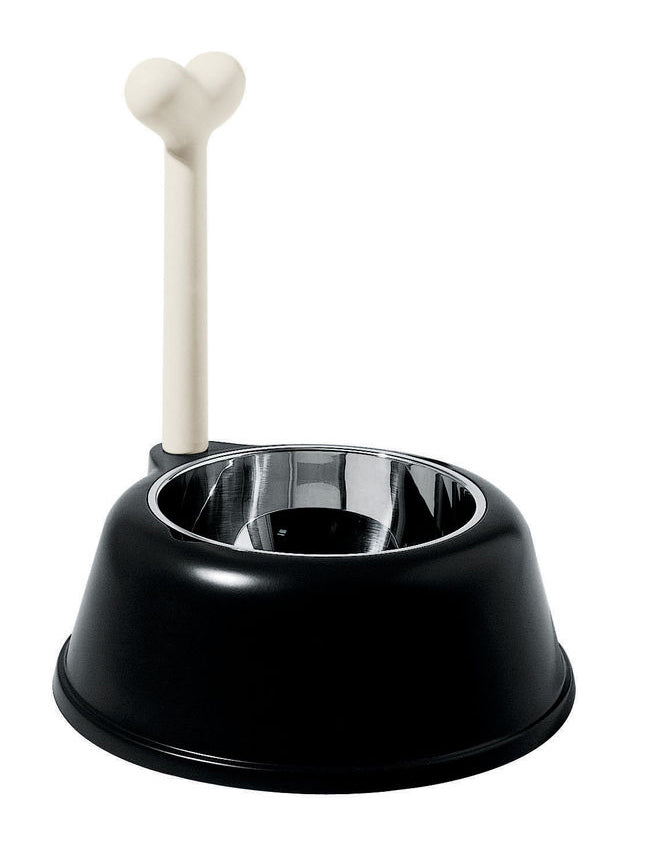 A black dog bowl made of thermoplastic resin with a stainless steel insert and a bone-shaped stand. Alessi design.