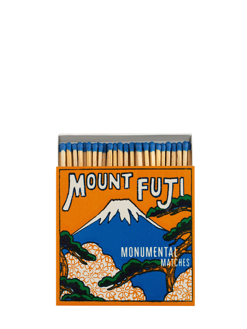 A matchbox with a vintage design featuring Mount Fuji on the cover, along with the text 'Mount Fuji' and 'Monumental Matches'.