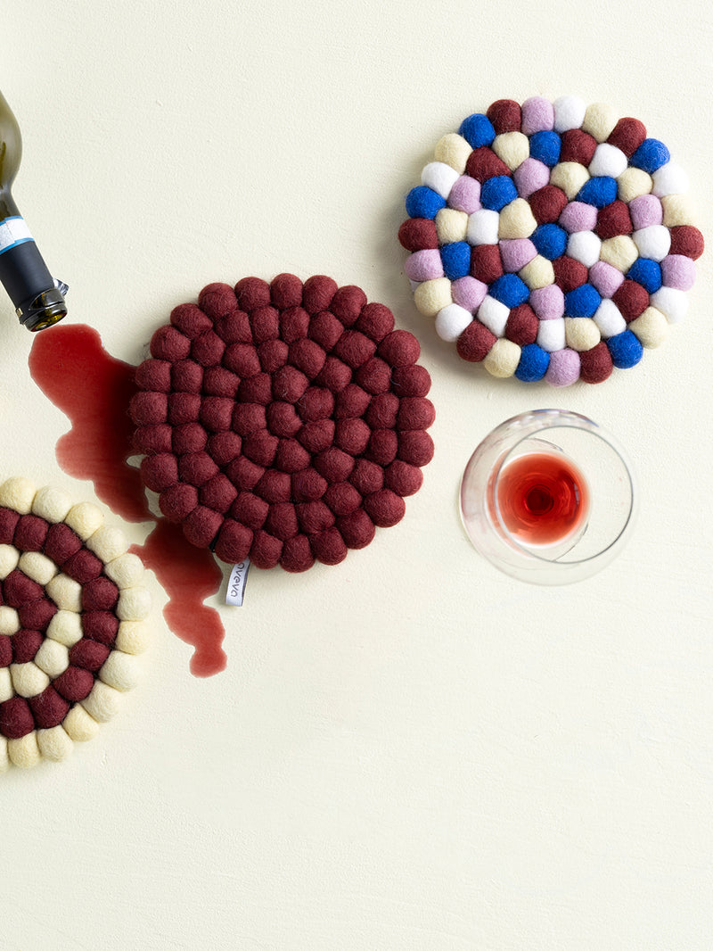 Round felted wool trivet, city multi