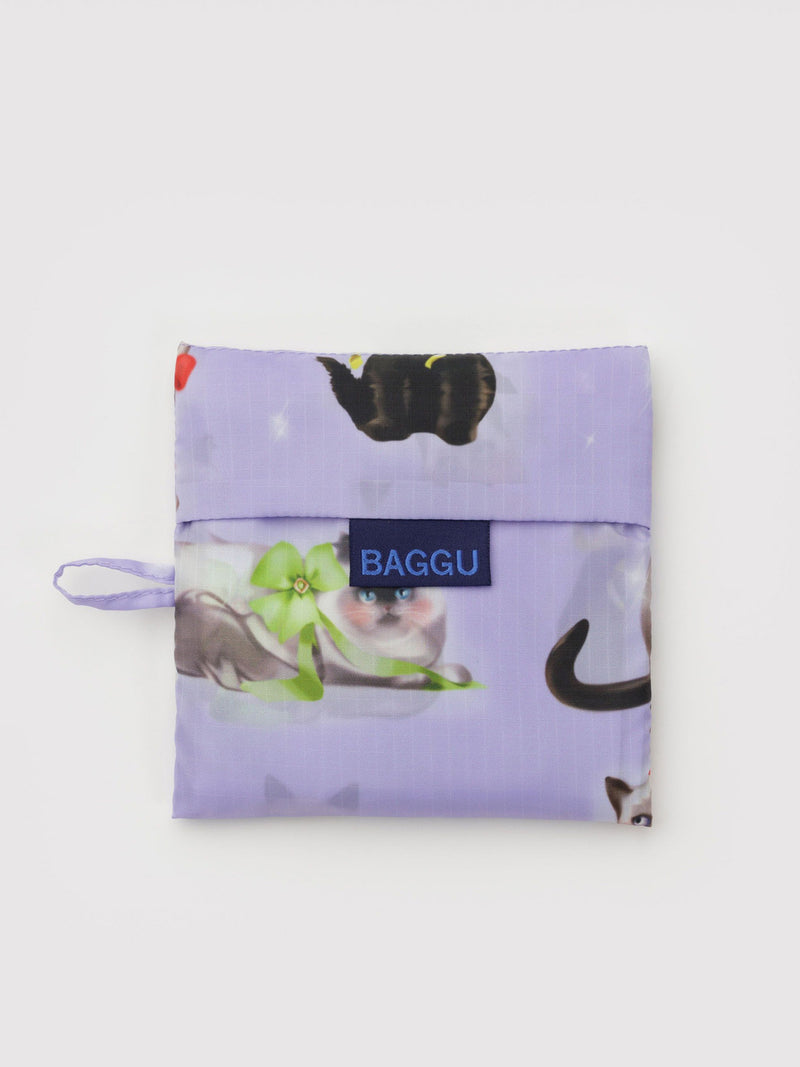 Purple reusable bag with cat design and 'BAGGU' branding on a white background