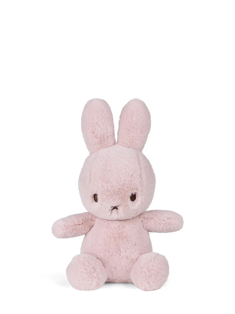 Pink plush bunny toy on a white background