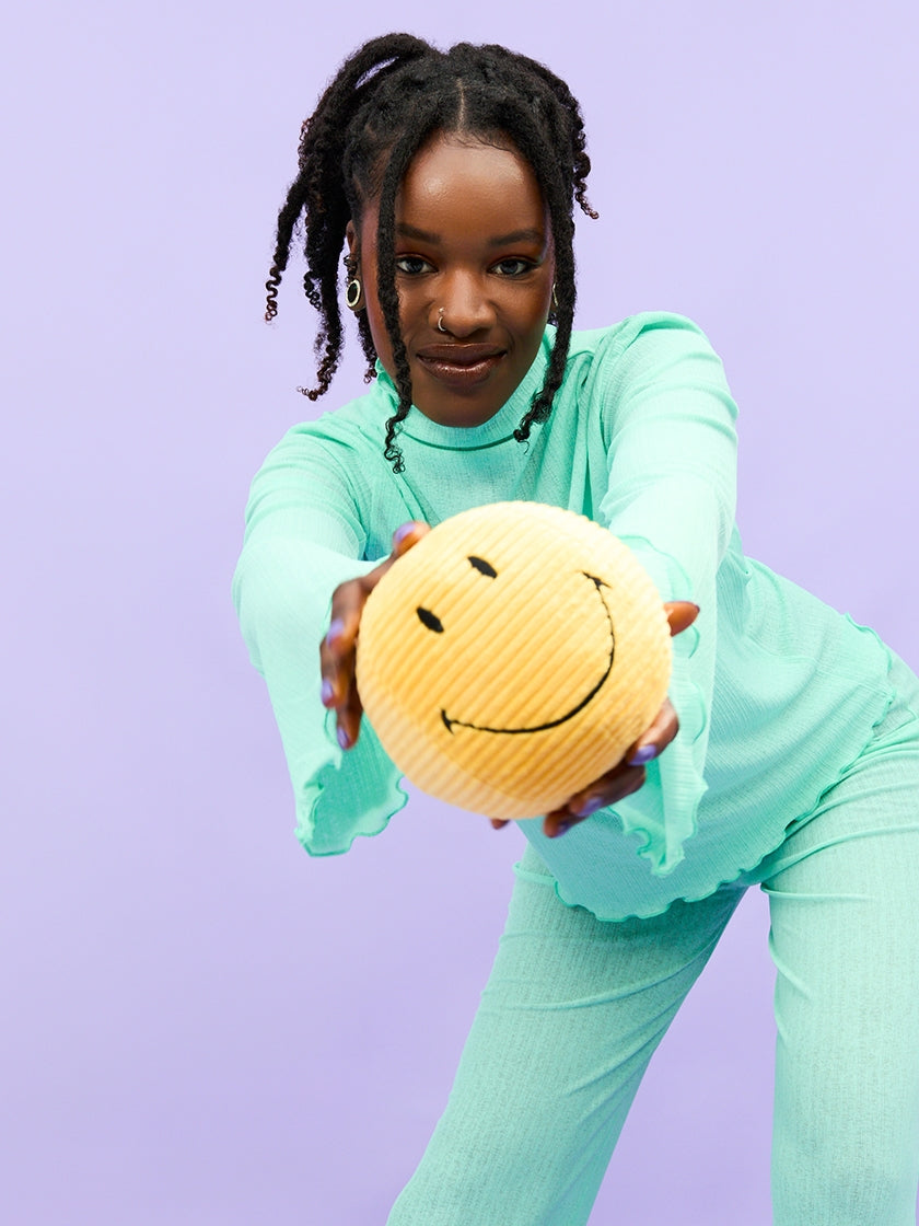 The corduroy smiley face plush toy is great for teenagers too