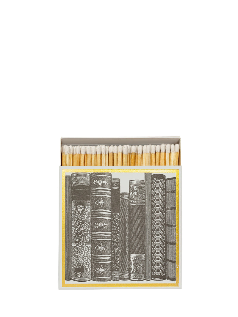 Matches in a box with book design on a white background