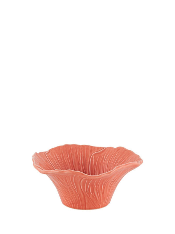 A pink earthenware Hollyhock bowl with a whimsical, flower petal-like design on the rim.