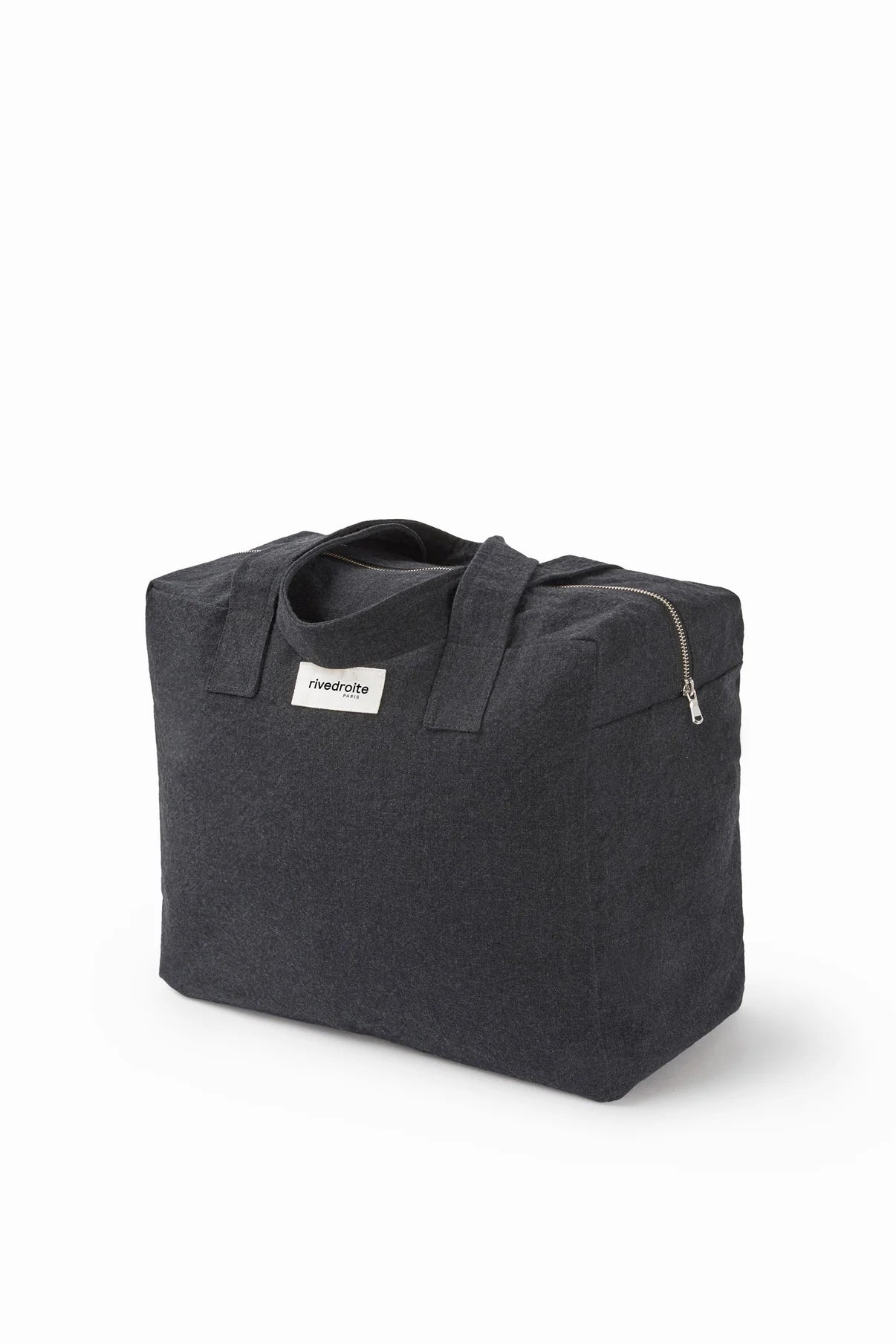 Black tote bag with a visible brand label on a white background