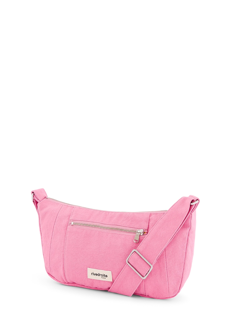 Pink crossbody bag with a visible brand logo on a white background