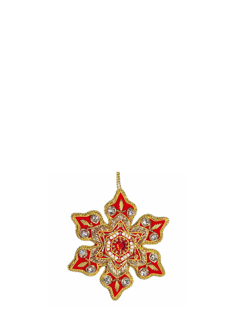A red and gold star-shaped decorative ornament with intricate metallic detailing and small clear rhinestones, shown against a plain white background.