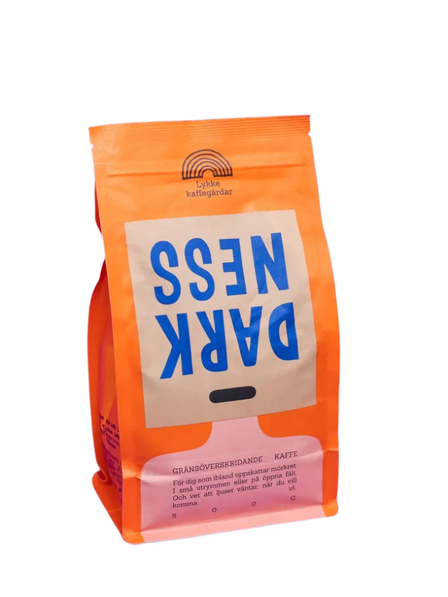 A package of Lykke Darkness ground coffee, with orange and white branding and blue text.