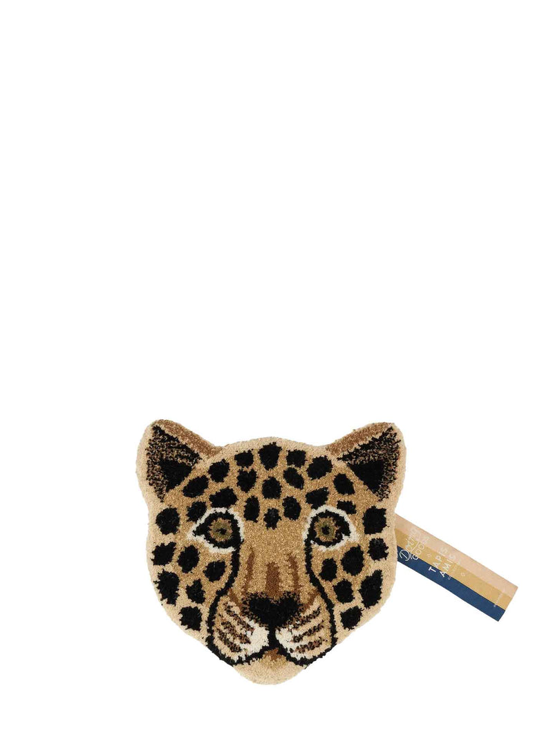A leopard head shaped tufted rug in beige, black, and brown on a plain white background.