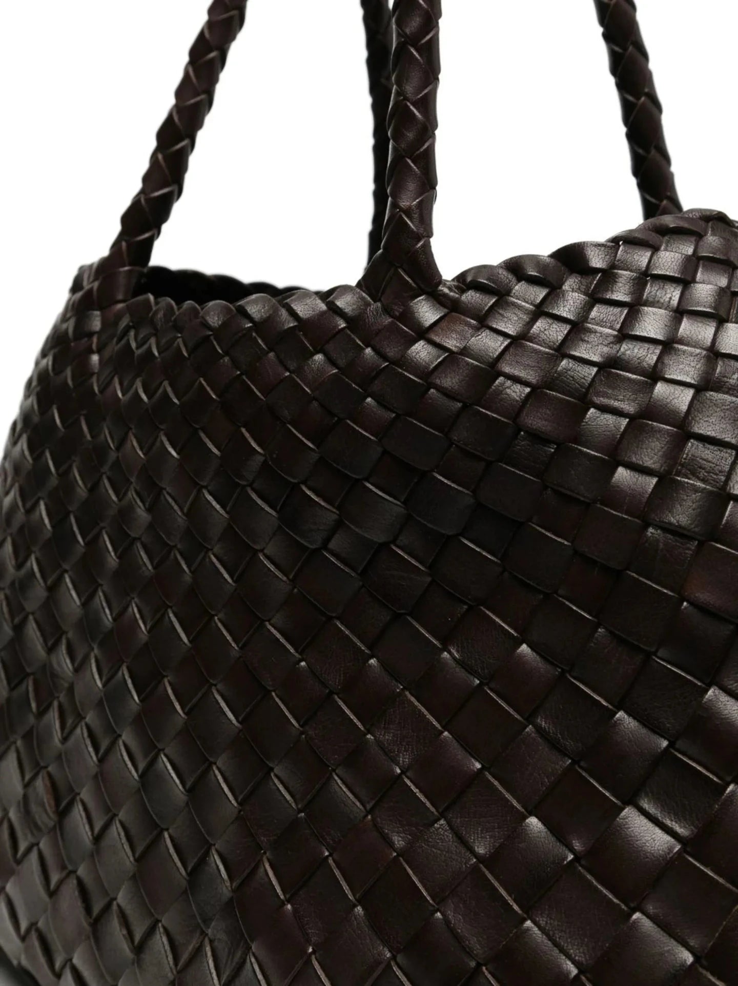 Close-up of a dark brown woven leather handbag.
