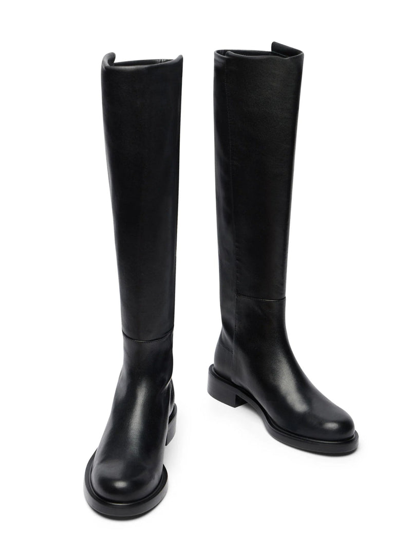 Pair of black knee-high boots on a white background