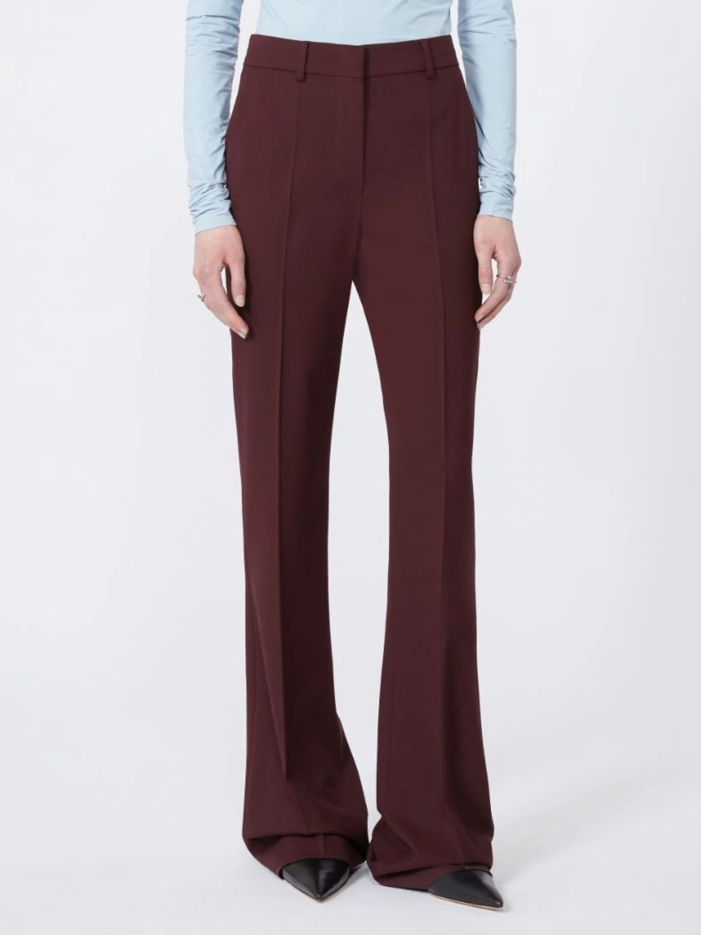 Maroon wide-leg pants worn by a person on a white background