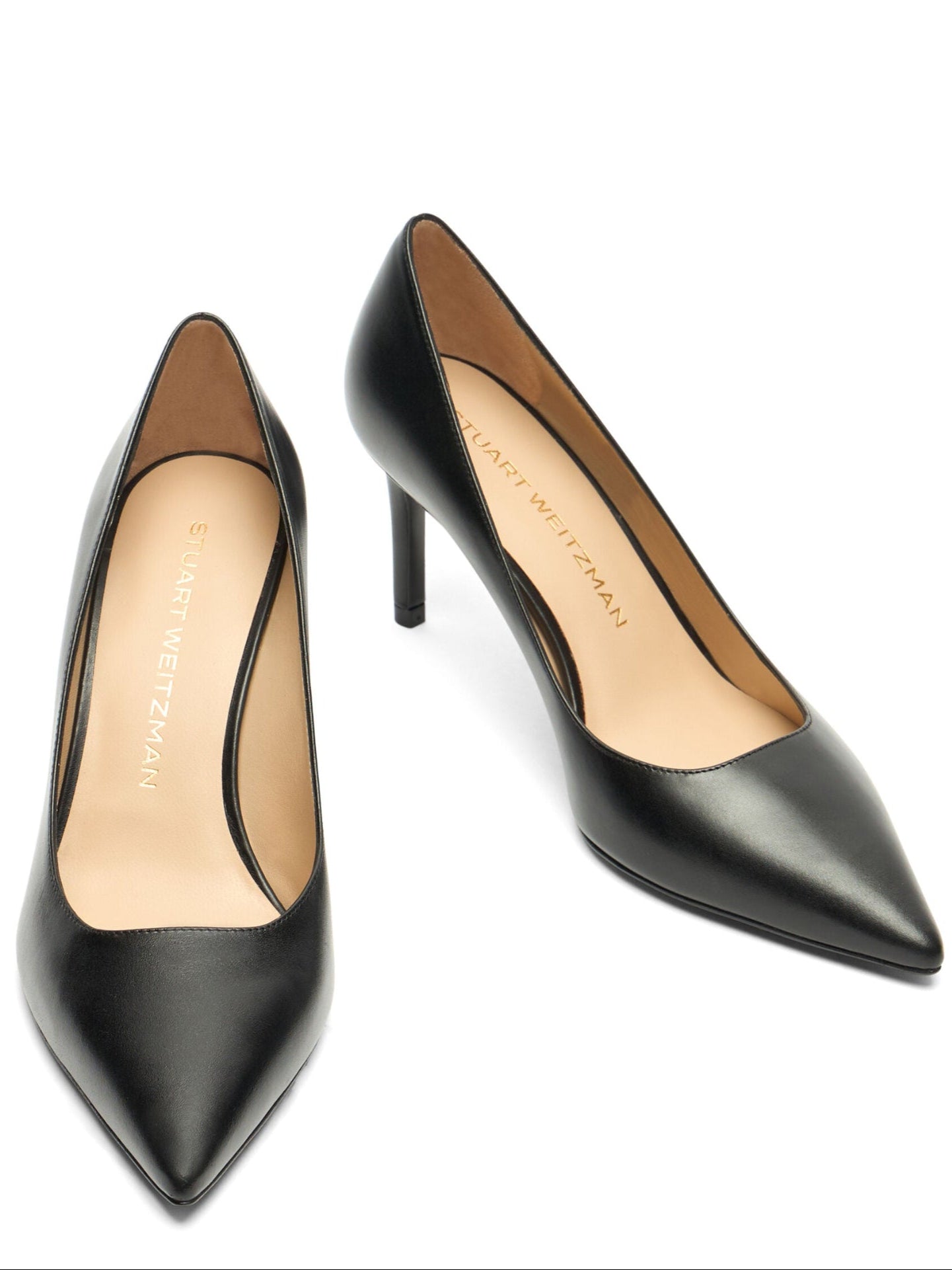 Pair of black high-heeled shoes on a white background