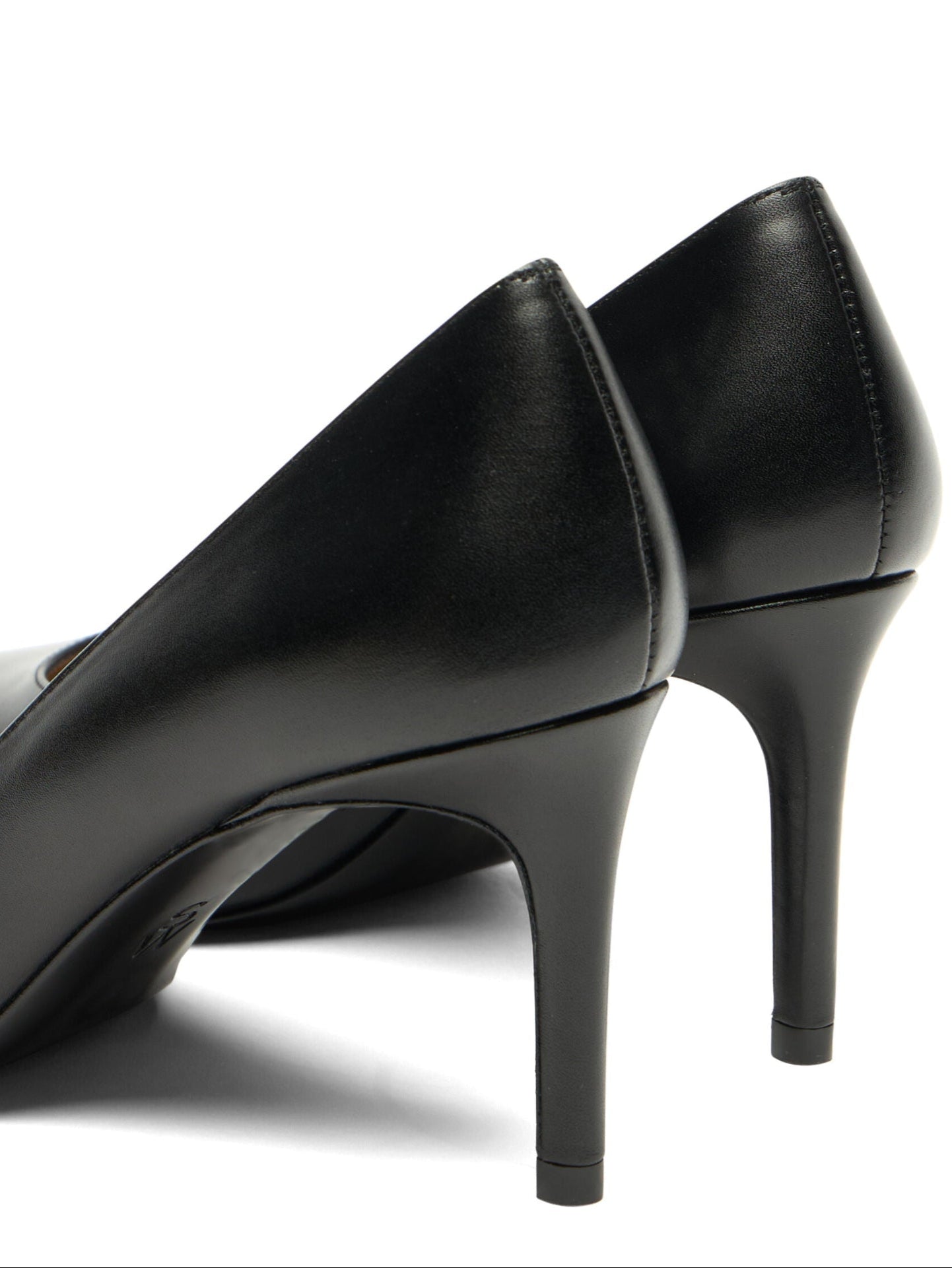 Black high-heeled shoes on a white background