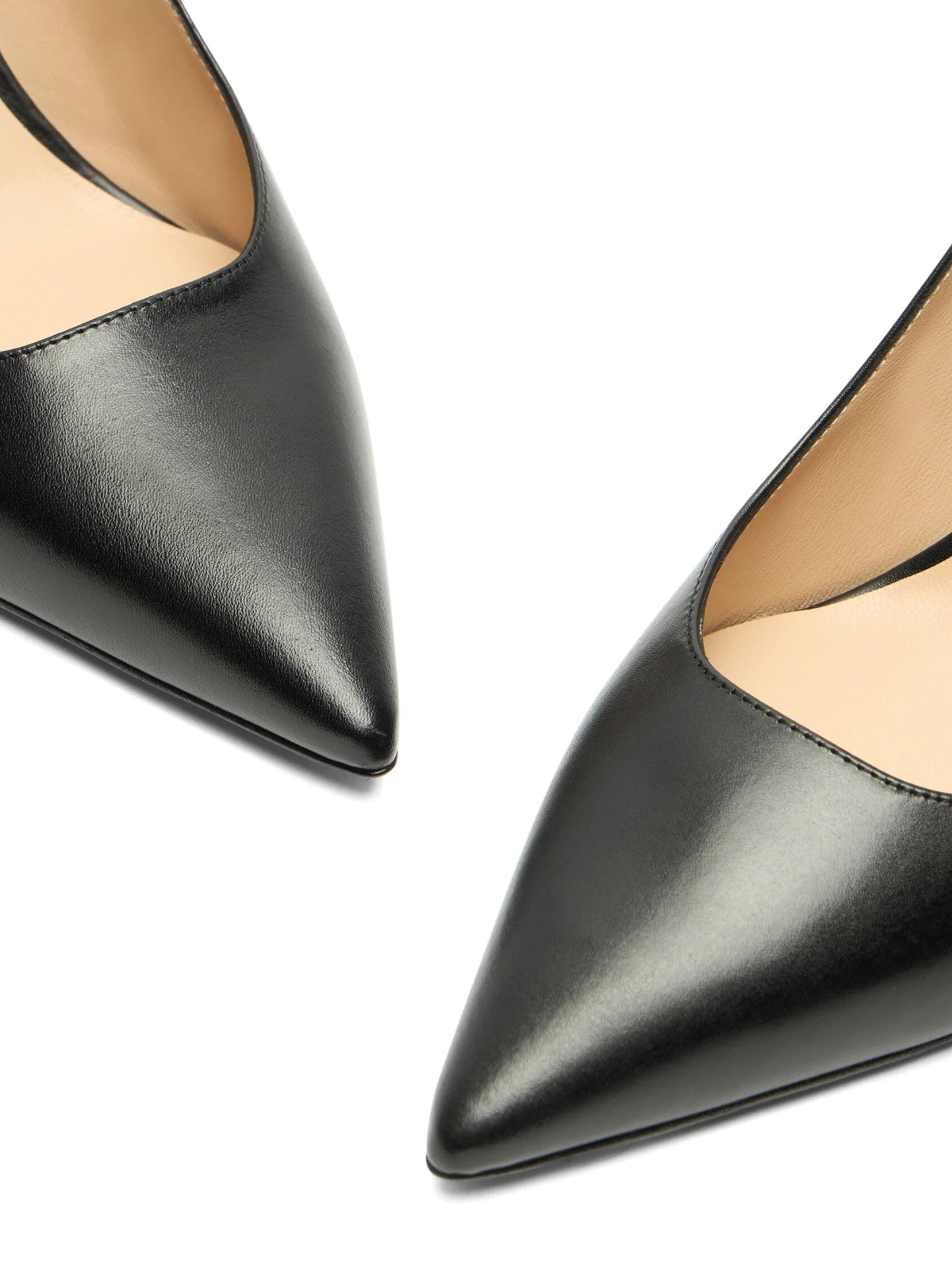 Black pointed-toe shoes on a white background