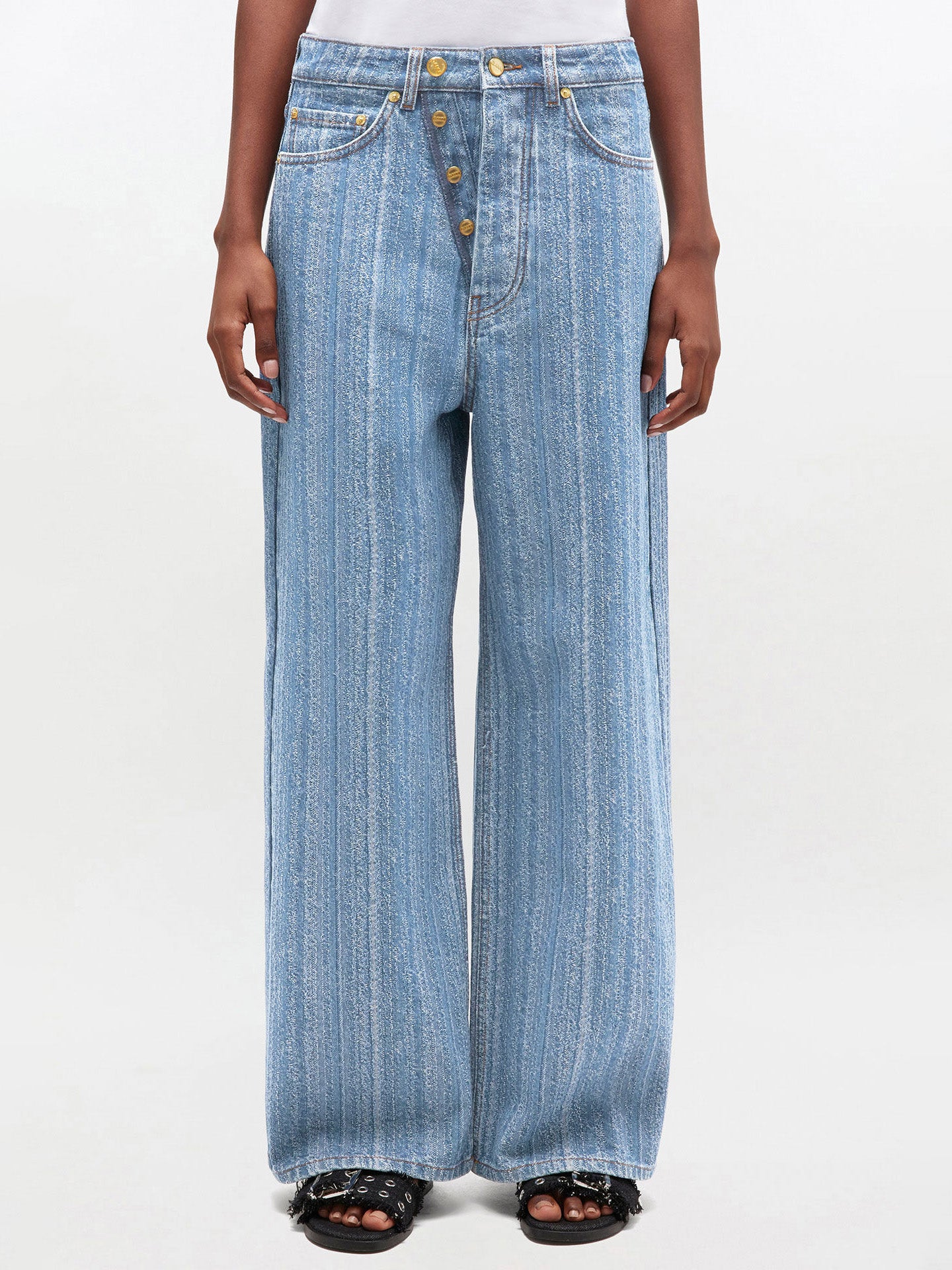 Wide-leg jeans worn by a person on a white background