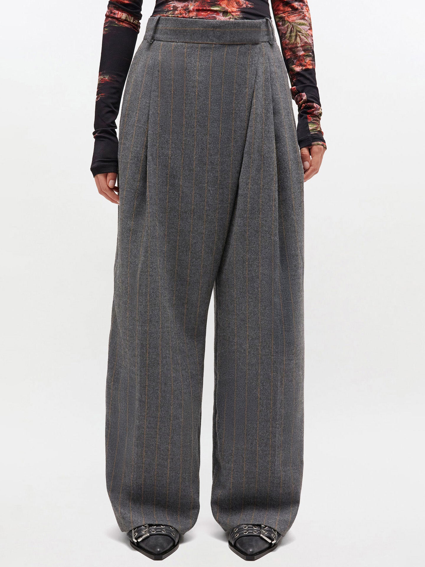 Gray wide-leg pants worn by a person on a white background